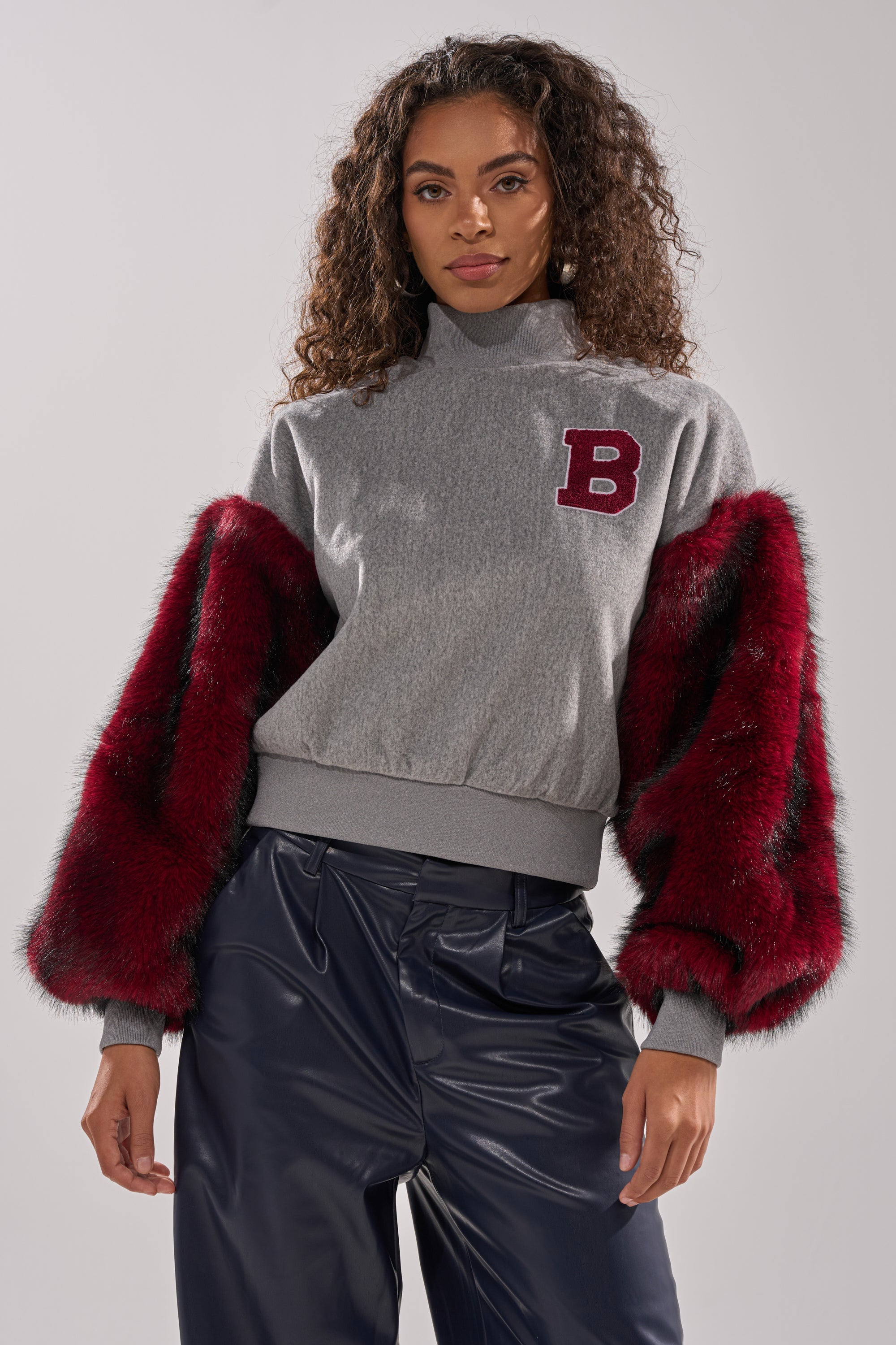 NEW EAST SIDE FAUX FUR SLEEVE SWEATSHIRT