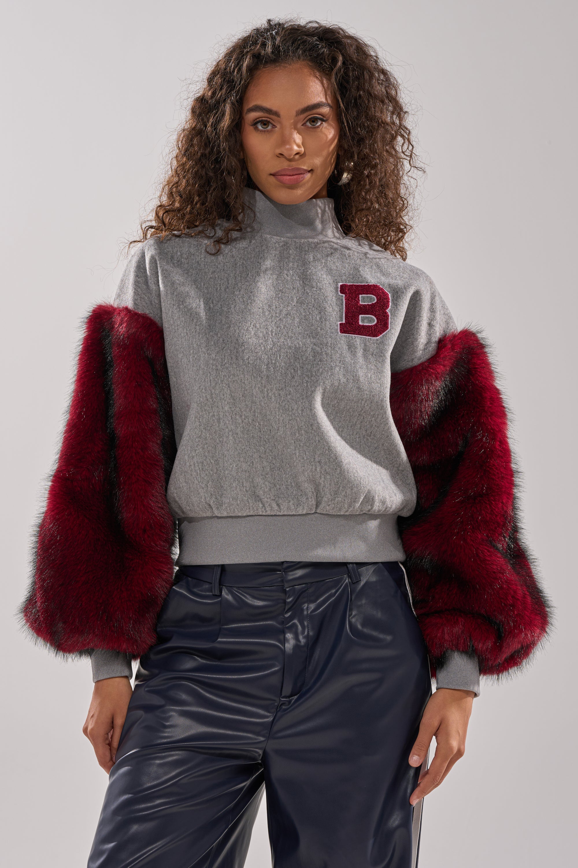 NEW EAST SIDE FAUX FUR SLEEVE SWEATSHIRT