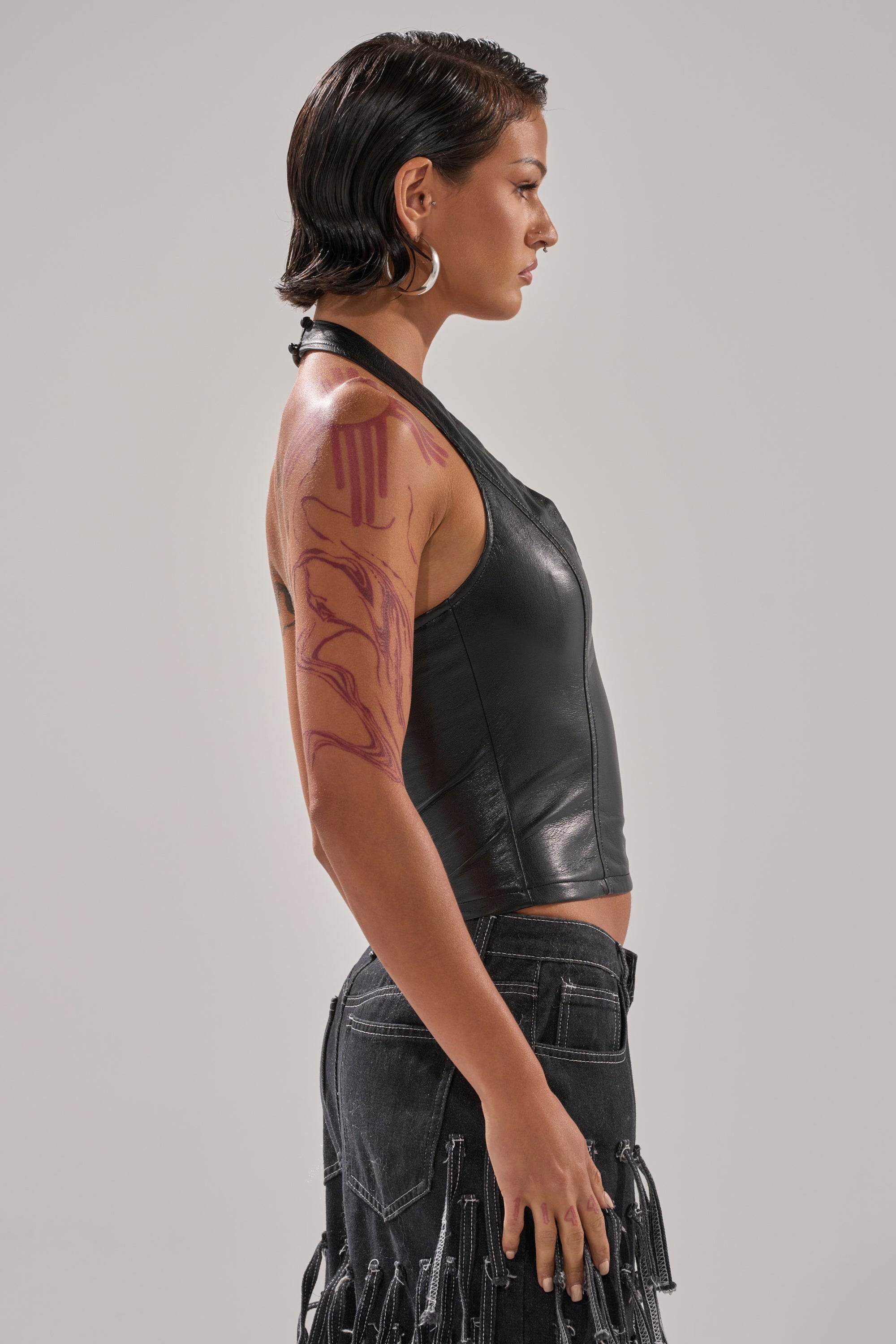 WITHOUT A DOUBT FAUX LEATHER HALTER NECK CORSET IN BLACK